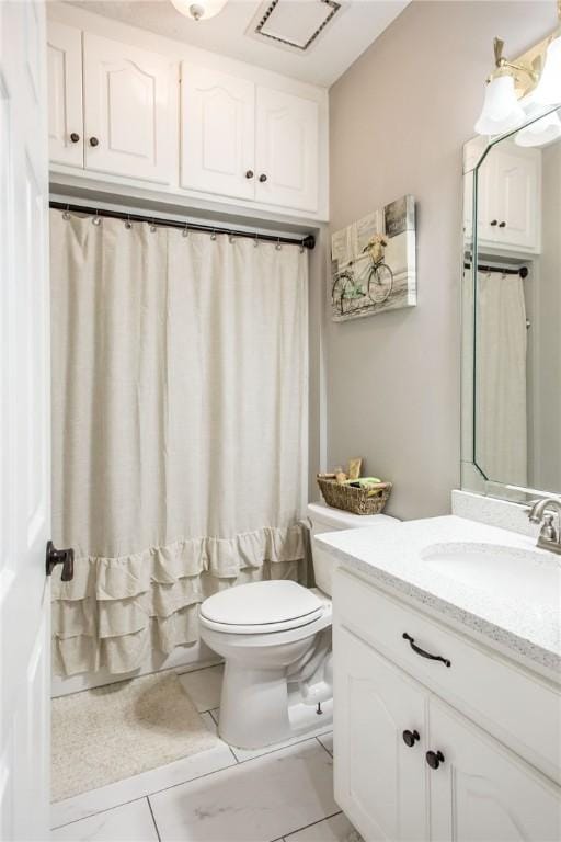 full bathroom featuring toilet, vanity, and shower / bath combo with shower curtain