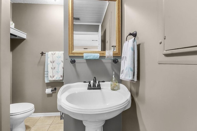 1020 NE Pine Point Ln, Townsend, GA 31331 - bathroom featuring baseboards and tile patterned floors