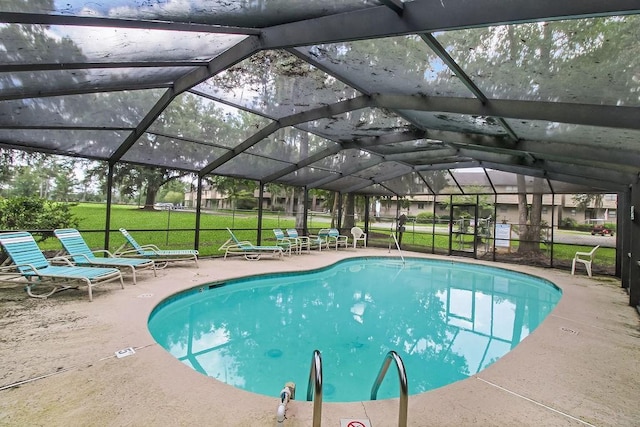 1020 NE Pine Point Ln, Townsend, GA 31331 - outdoor pool with a patio area, a lawn, and a lanai