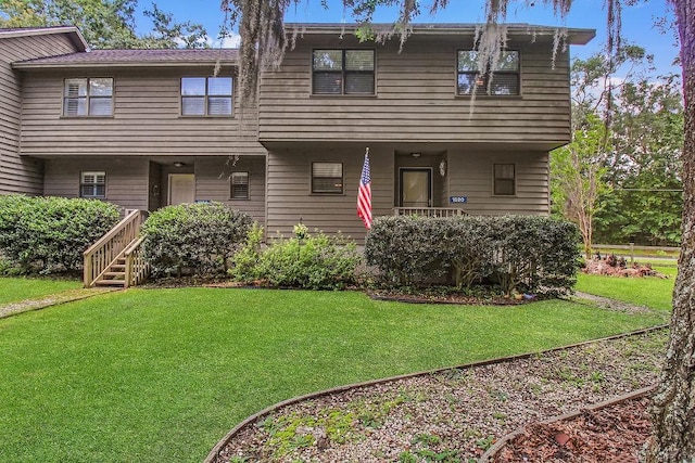 1020 NE Pine Point Ln, Townsend, GA 31331 - view of front facade with a front lawn and covered porch