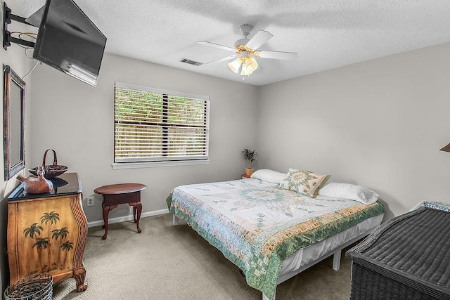 1020 NE Pine Point Ln, Townsend, GA 31331 - carpeted bedroom featuring a ceiling fan and a textured ceiling