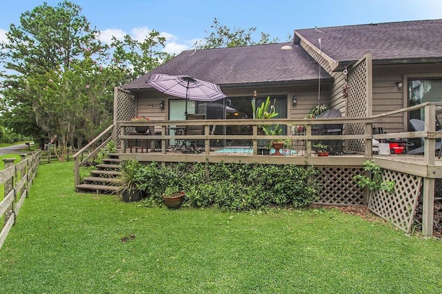 1020 NE Pine Point Ln, Townsend, GA 31331 - back of property with roof with shingles and a deck