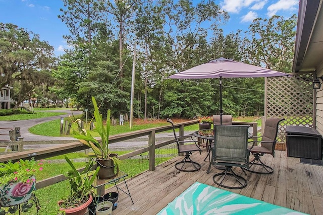 1020 NE Pine Point Ln, Townsend, GA 31331 - wooden deck featuring outdoor dining space