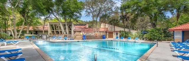 view of swimming pool with a patio area