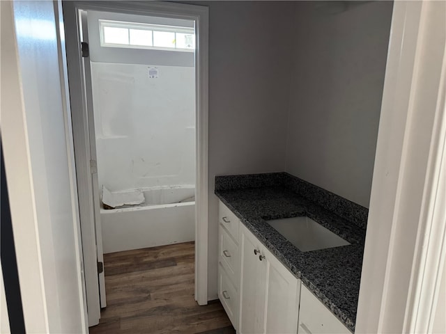 bathroom featuring vanity and hardwood / wood-style floors