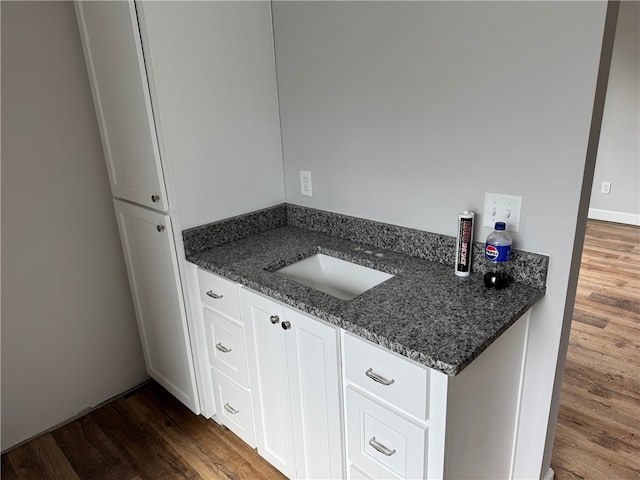 bathroom with wood-type flooring and vanity