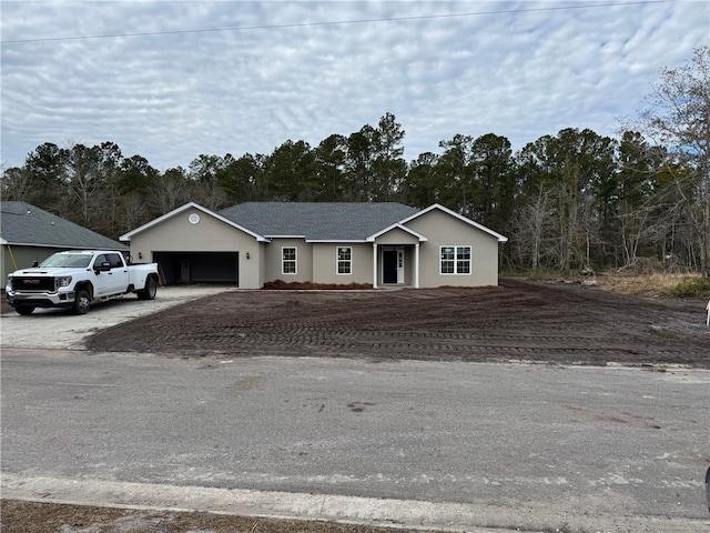 single story home featuring a garage