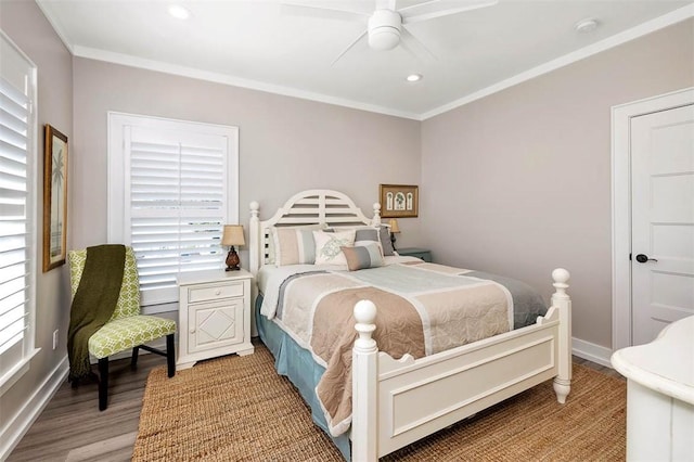 bedroom featuring crown molding, ceiling fan, and hardwood / wood-style flooring