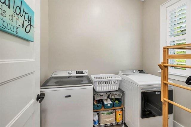 clothes washing area featuring washing machine and dryer