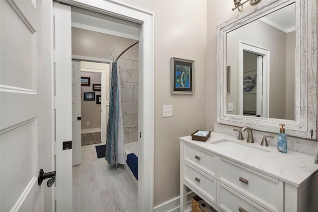 bathroom featuring shower / bath combo, wood-type flooring, and vanity