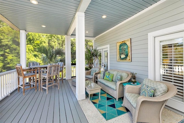 wooden deck featuring an outdoor hangout area