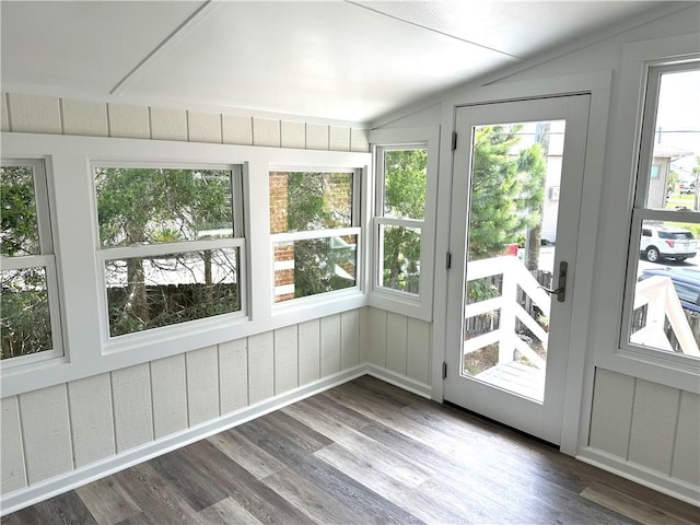 unfurnished sunroom with vaulted ceiling