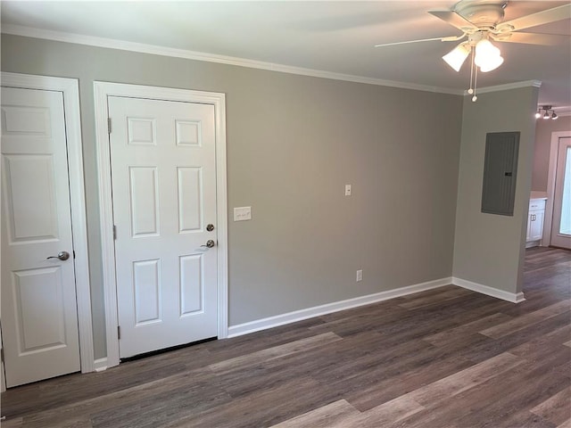 unfurnished room with electric panel, crown molding, ceiling fan, and dark wood-type flooring