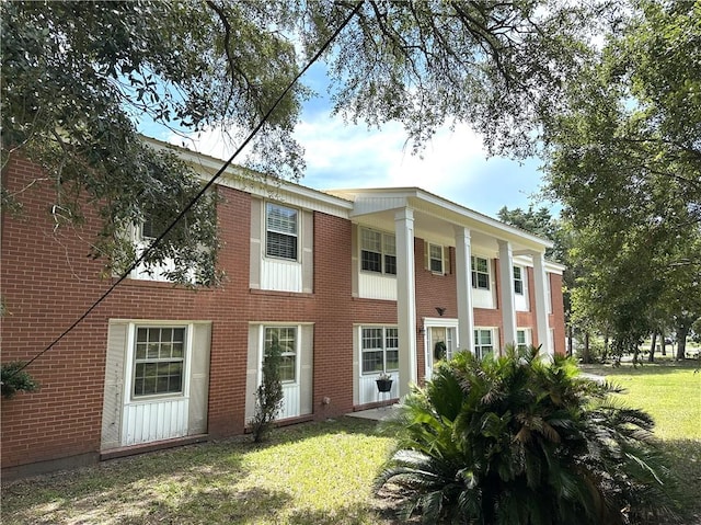 rear view of house with a yard