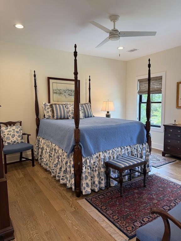 bedroom with visible vents, wood finished floors, a ceiling fan, and recessed lighting