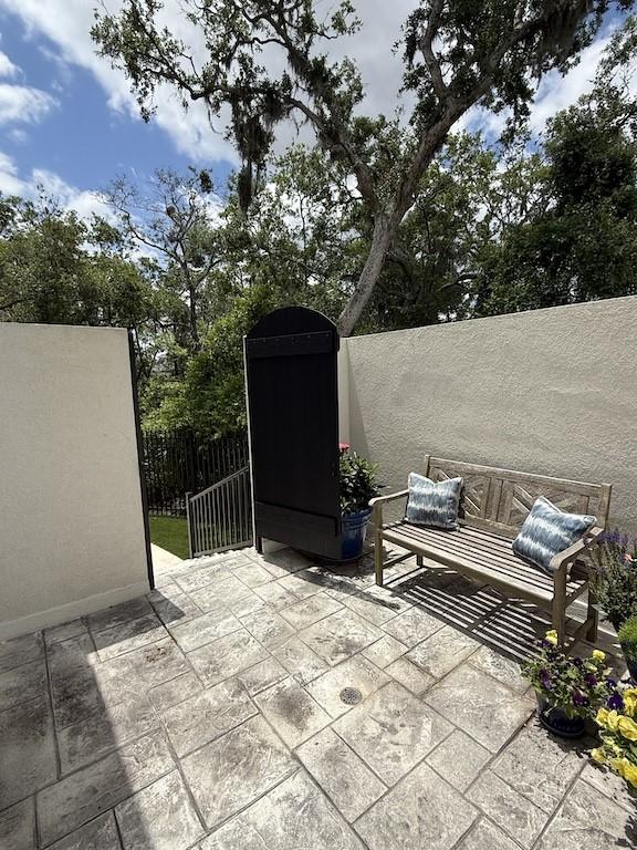 view of patio featuring fence
