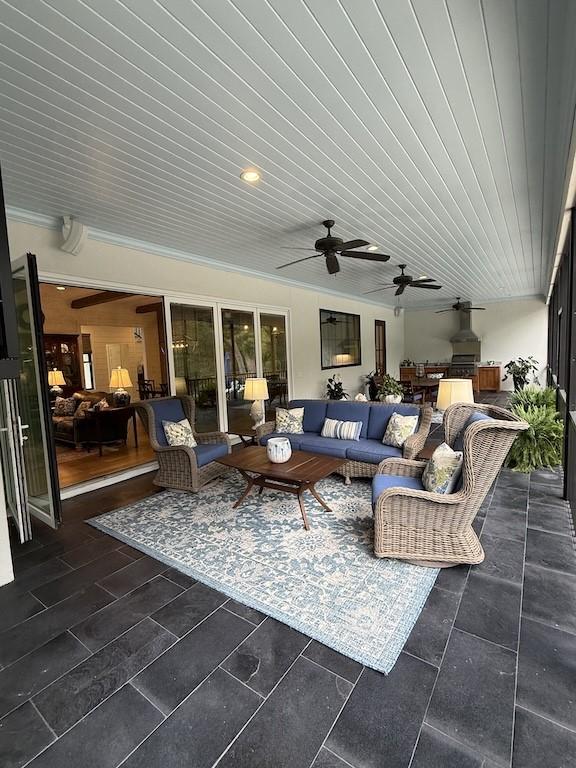 view of patio / terrace with an outdoor hangout area and a ceiling fan
