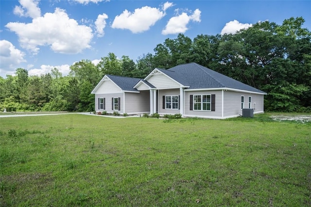 ranch-style home with cooling unit and a front lawn