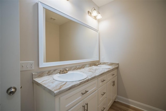 860 Kaitlyn Ave, Odum, GA 31555 - bathroom featuring wood-type flooring and vanity