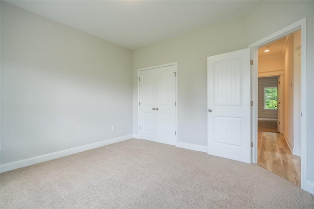 860 Kaitlyn Ave, Odum, GA 31555 - unfurnished bedroom featuring light colored carpet