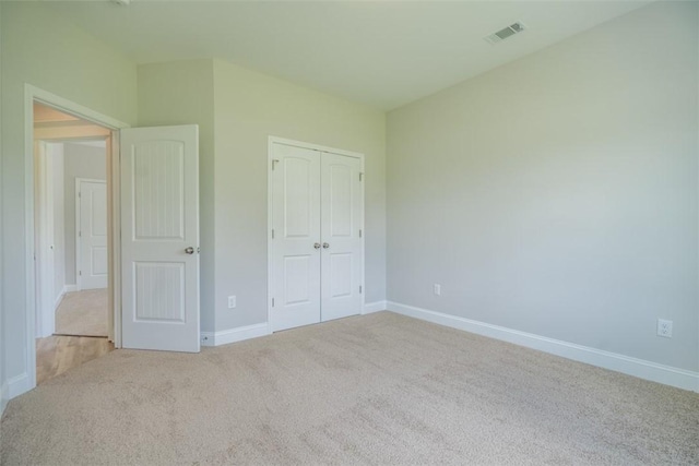 860 Kaitlyn Ave, Odum, GA 31555 - unfurnished bedroom with light colored carpet and a closet