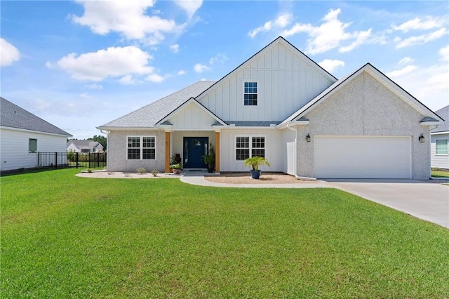 view of front of house with a front yard and a garage