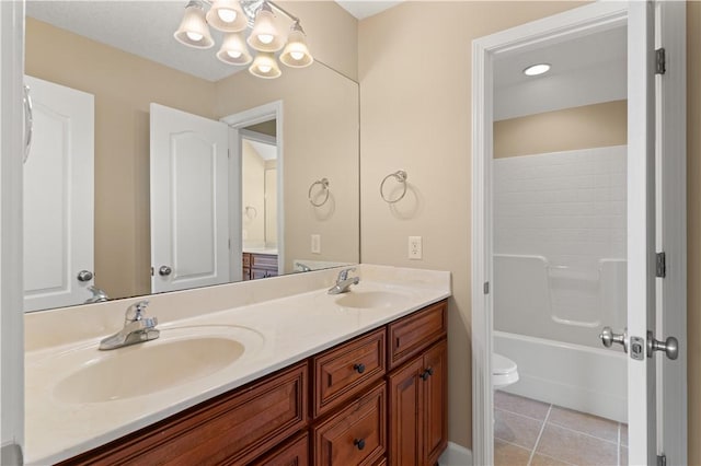 full bathroom featuring tile patterned flooring, vanity, shower / bath combination, and toilet