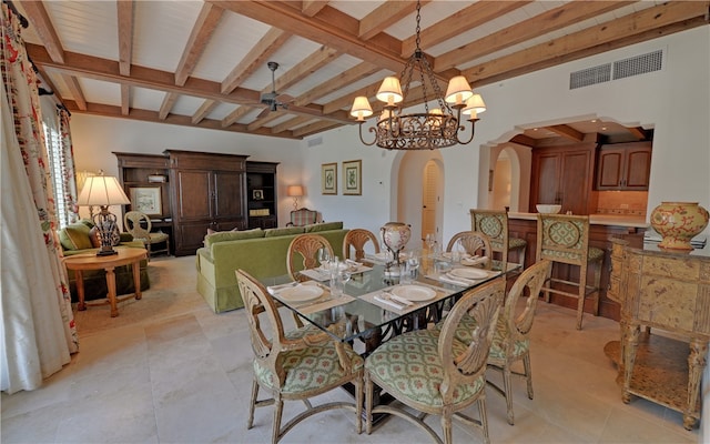 tiled dining room featuring beamed ceiling and a chandelier