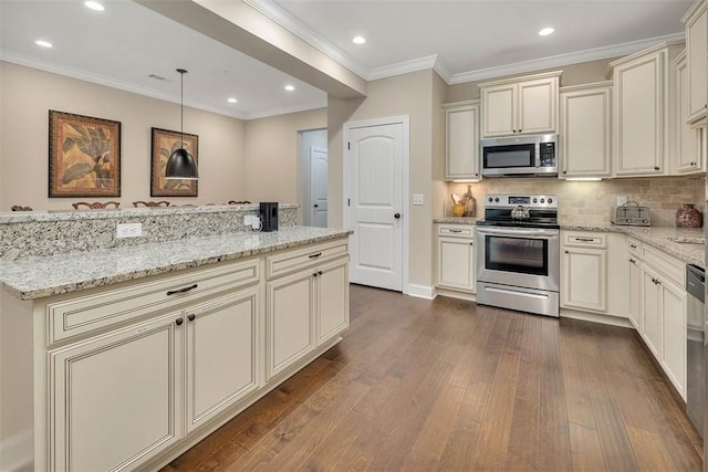 kitchen featuring decorative light fixtures, decorative backsplash, stainless steel appliances, light stone countertops, and cream cabinetry