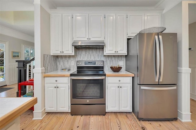 kitchen featuring white cabinetry, under cabinet range hood, light countertops, and appliances with stainless steel finishes