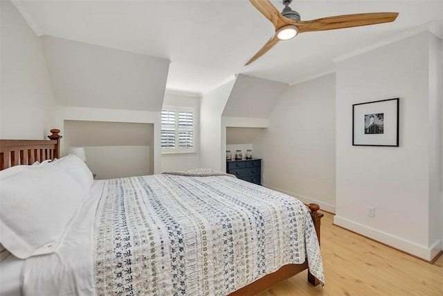 bedroom with wood finished floors, baseboards, lofted ceiling, ceiling fan, and ornamental molding