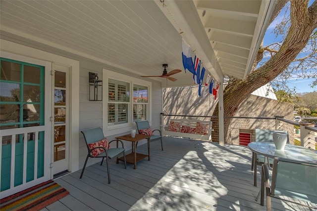 wooden deck with ceiling fan