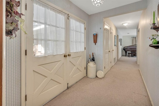 753 N Riverview Dr, Jekyll Island, GA 31527 - doorway to outside featuring light carpet