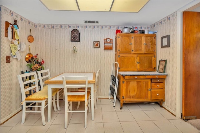 dining room featuring light tile patterned flooring