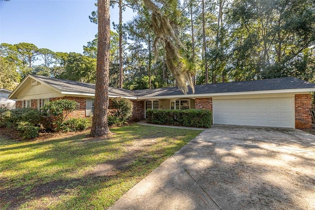 ranch-style home with a garage and a front yard