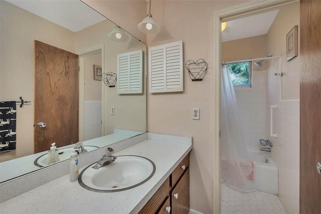 bathroom featuring tile patterned flooring, vanity, and shower / bathtub combination with curtain