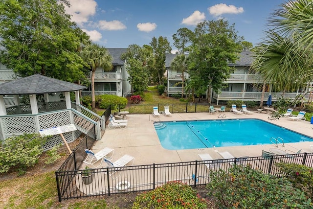 view of swimming pool featuring a gazebo and a patio area