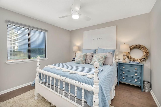 bedroom featuring ceiling fan and dark wood-type flooring