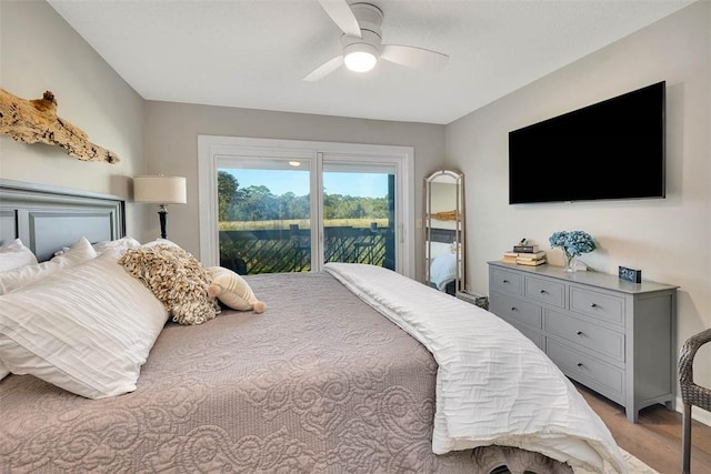 bedroom with ceiling fan, light hardwood / wood-style floors, and access to exterior