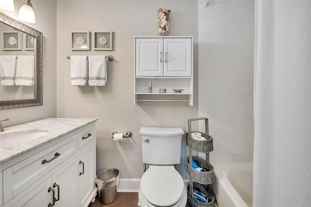 full bathroom featuring shower / tub combo with curtain, vanity, wood-type flooring, and toilet