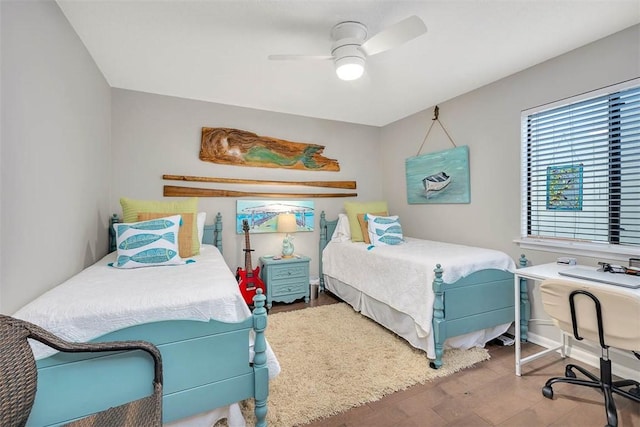 bedroom featuring ceiling fan and wood-type flooring