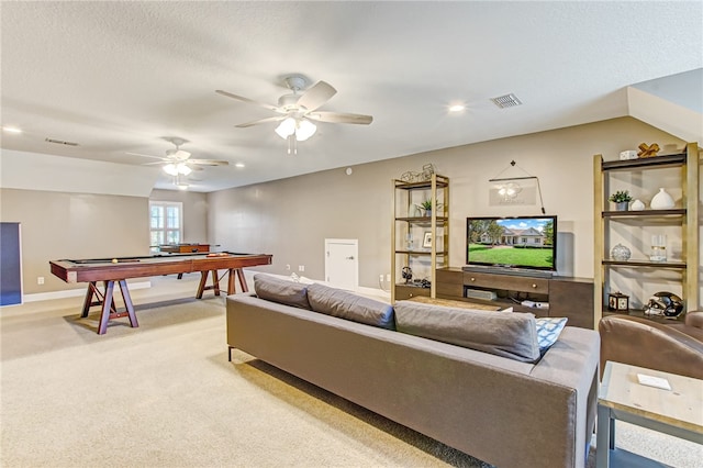 living room with pool table, visible vents, a ceiling fan, and light colored carpet