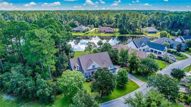 birds eye view of property with a residential view, a water view, and a forest view