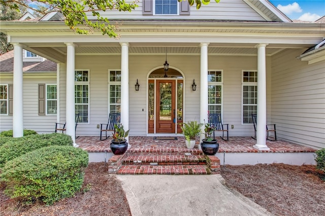 entrance to property featuring a porch