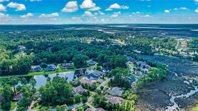 drone / aerial view with a water view and a residential view