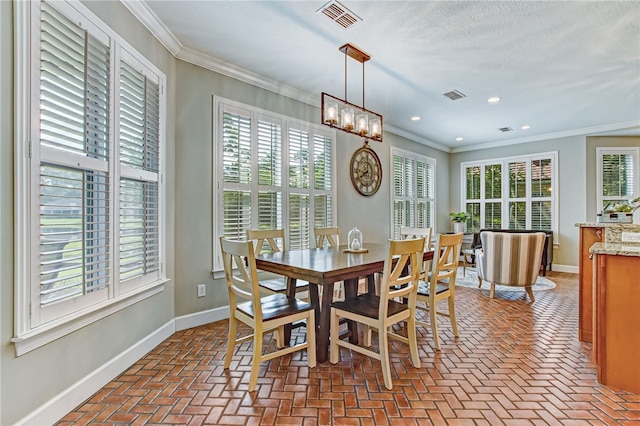 dining room featuring ornamental molding, brick floor, visible vents, and baseboards