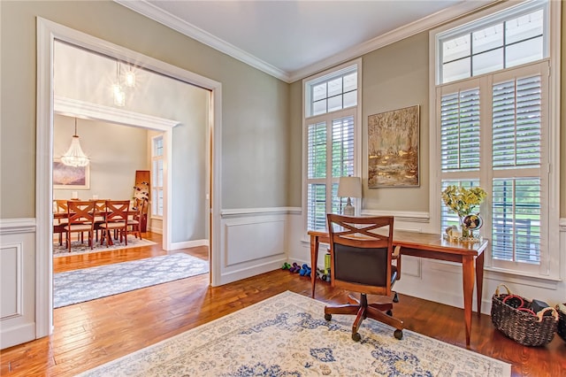 office with a wainscoted wall, ornamental molding, a decorative wall, and hardwood / wood-style floors