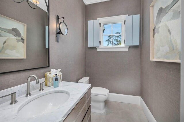 bathroom featuring tile patterned floors, vanity, and toilet