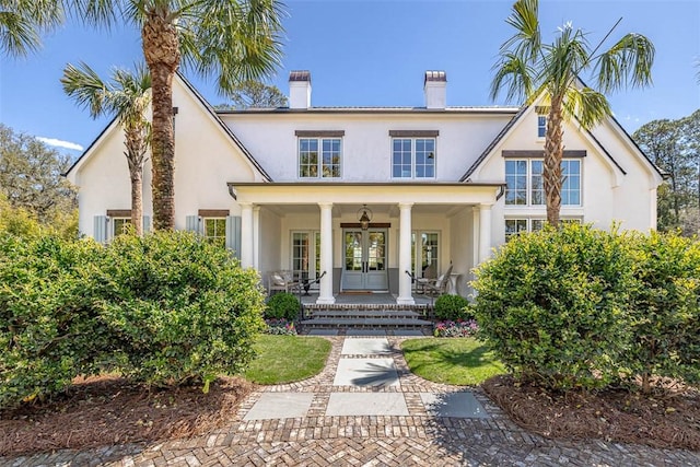 view of front of property featuring a porch and french doors