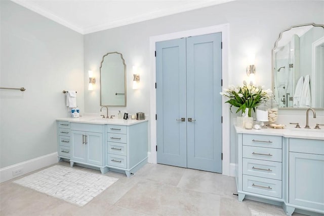 bathroom featuring tile patterned flooring, vanity, and ornamental molding